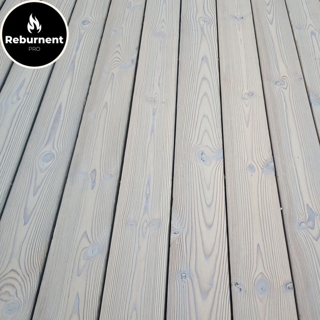 Close-up of charred wood decking in “White” shade showing natural grain and smooth texture
