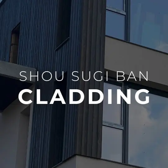 Modern building with vertical charred wood cladding, treated using Shou Sugi Ban (Yakisugi) technique for durable exterior finish